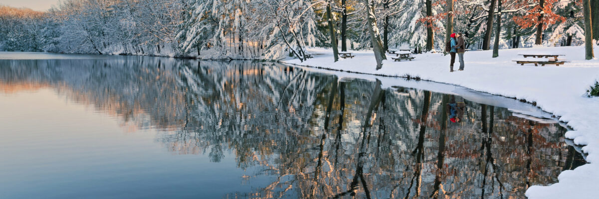 Beautiful,Snowy,Scene,At,Sunset,With,A,Couple,Kissing,In